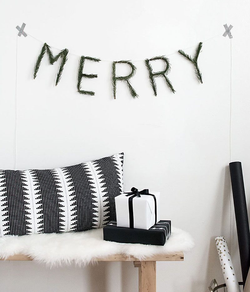 30 Modern Christmas Decor Ideas For Your Home // This DIY garland brings in a touch of nature and a cheerful Christmas message.