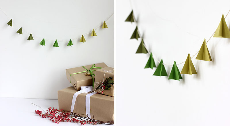 30 Modern Christmas Decor Ideas For Your Home // Add some minimal holiday decor to your walls with these paper Christmas trees hanging from festive string.