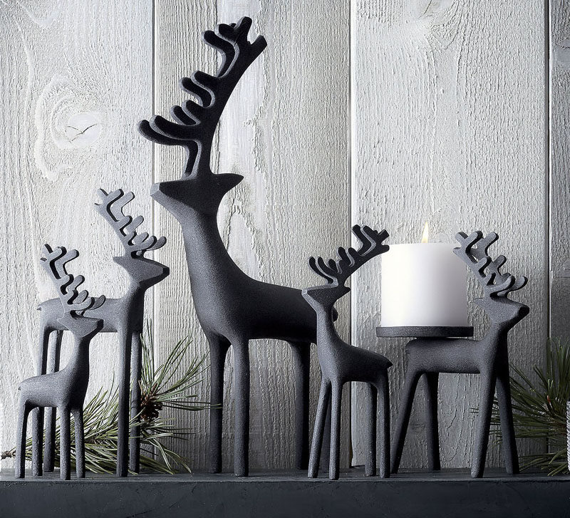 30 Modern Christmas Decor Ideas For Your Home // Zinc reindeer add a modern look to your mantle and a festive feel to your home.