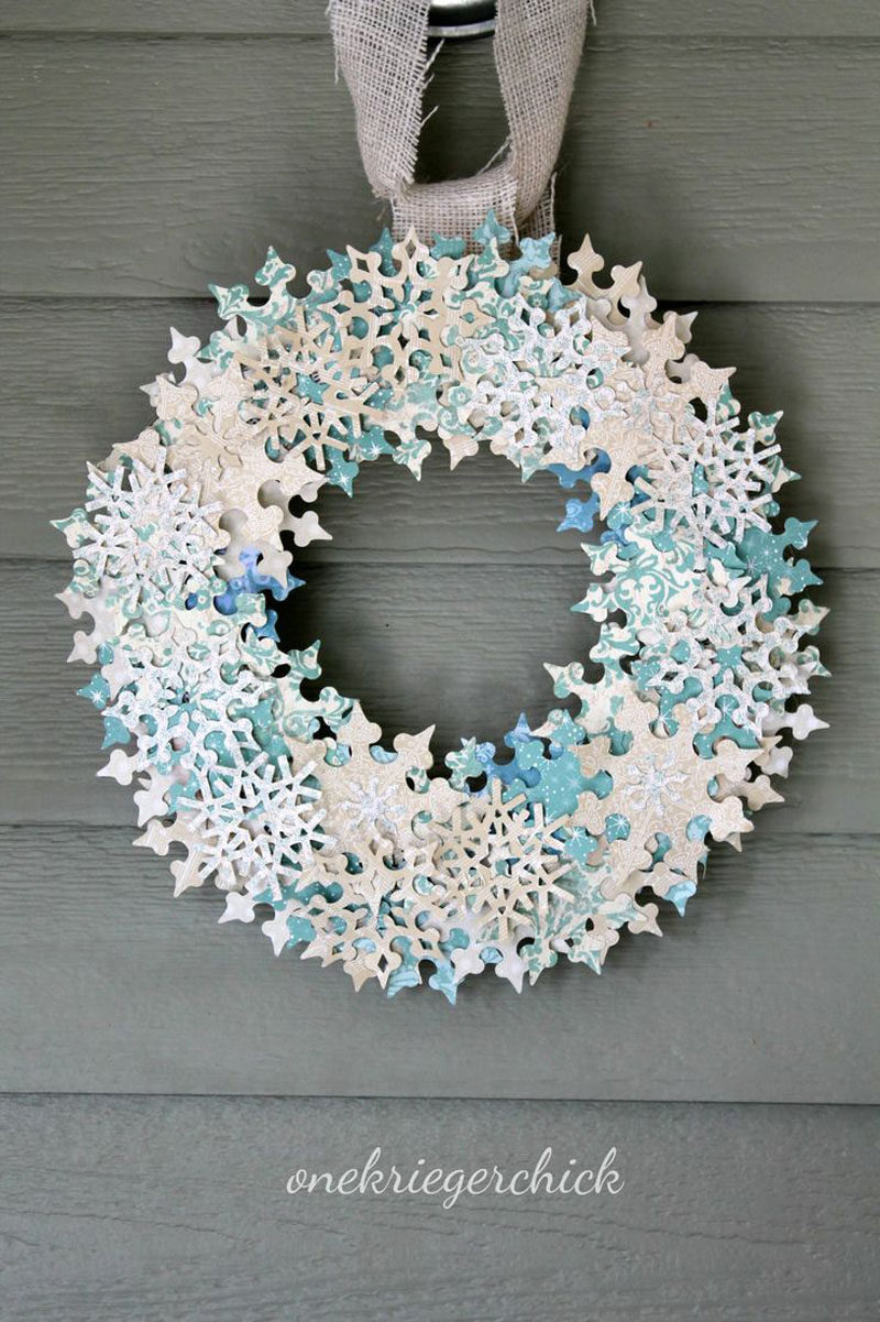 21 Modern Wreaths To Decorate Your Home With This Holiday Season // Sparkly snowflakes add just the right amount of glitter to this winter holiday wreath.