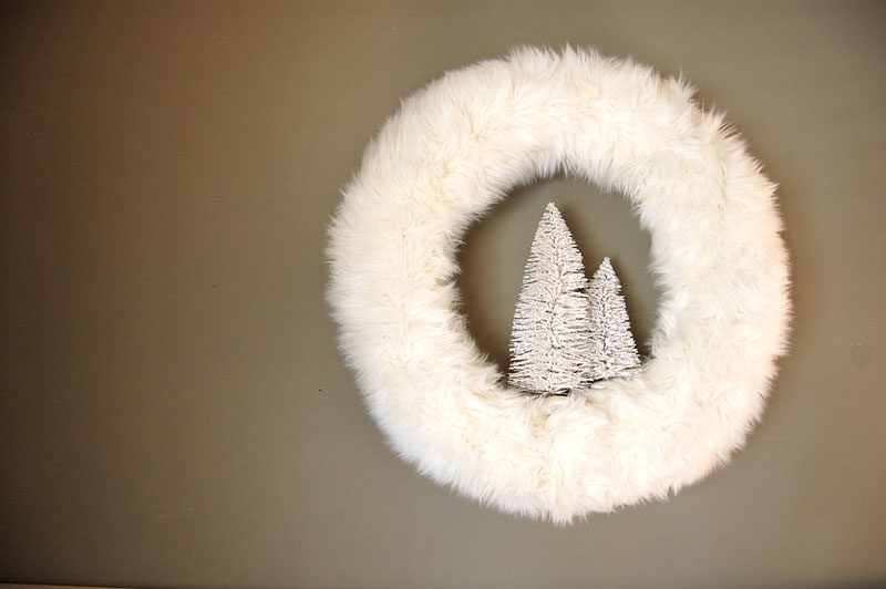 21 Modern Wreaths To Decorate Your Home With This Holiday Season // This festive white faux fur wreath will keep your door or mantle warm all season long.