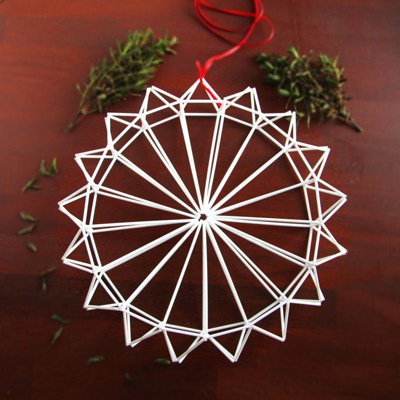 21 Modern Wreaths To Decorate Your Home With This Holiday Season // This white himmeli wreath would look just like a modern snowflake hanging from inside your window.