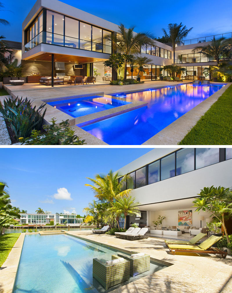 14 Examples Of Modern Beach Houses // A large swimming pool and plenty of palm trees give this Miami beach house a tropical feel that can be enjoyed even when it’s a less than perfect day.