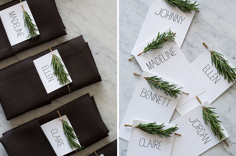 15 Inspirational Ideas For Creating A Modern Christmas Table Full Of Natural Elements // These simple name cards tuck nicely into a folded napkin and have a festive sprig of rosemary at the top to look like a mini Christmas tree.