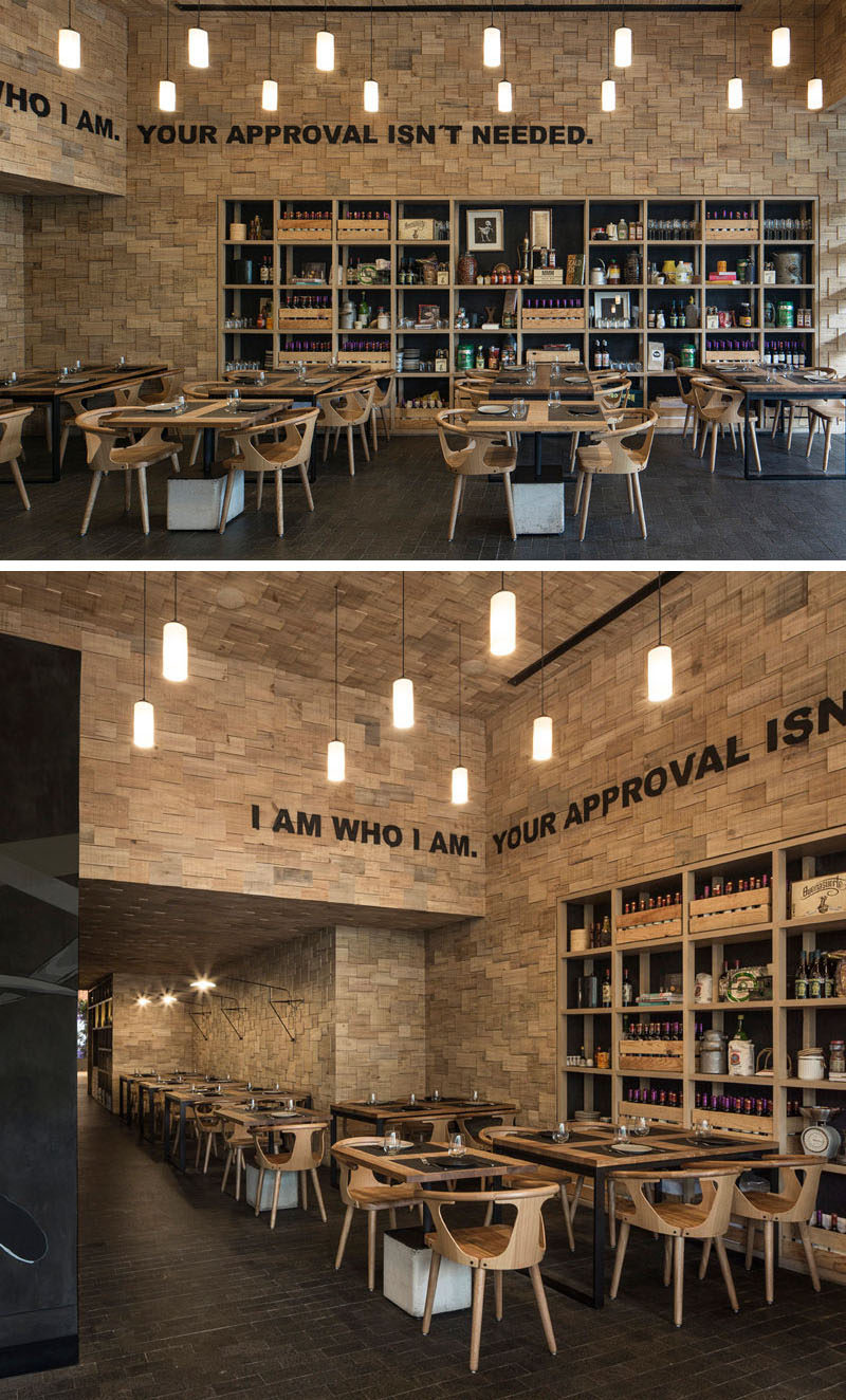 The walls of this modern restaurant are covered in wood shingles.