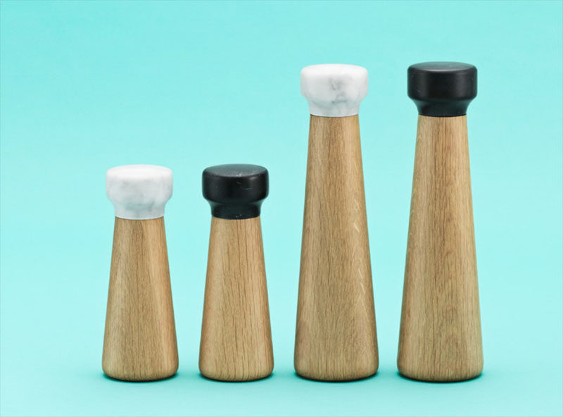 Essential Kitchen Tools - Salt and Pepper Mills // The use of wood and marble on these grinders makes for a timeless pair that will look great on your table or counter for years to come.