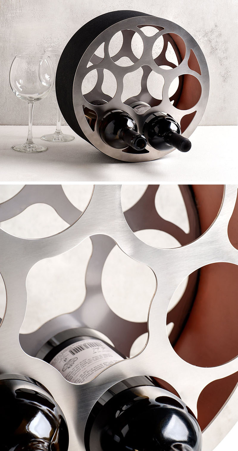 13 Wine Bottle Storage Ideas For Your Stylish Home // A steel wine wheel like this one adds a unique design piece to your home and creates a stylish spot to store your bottles.
