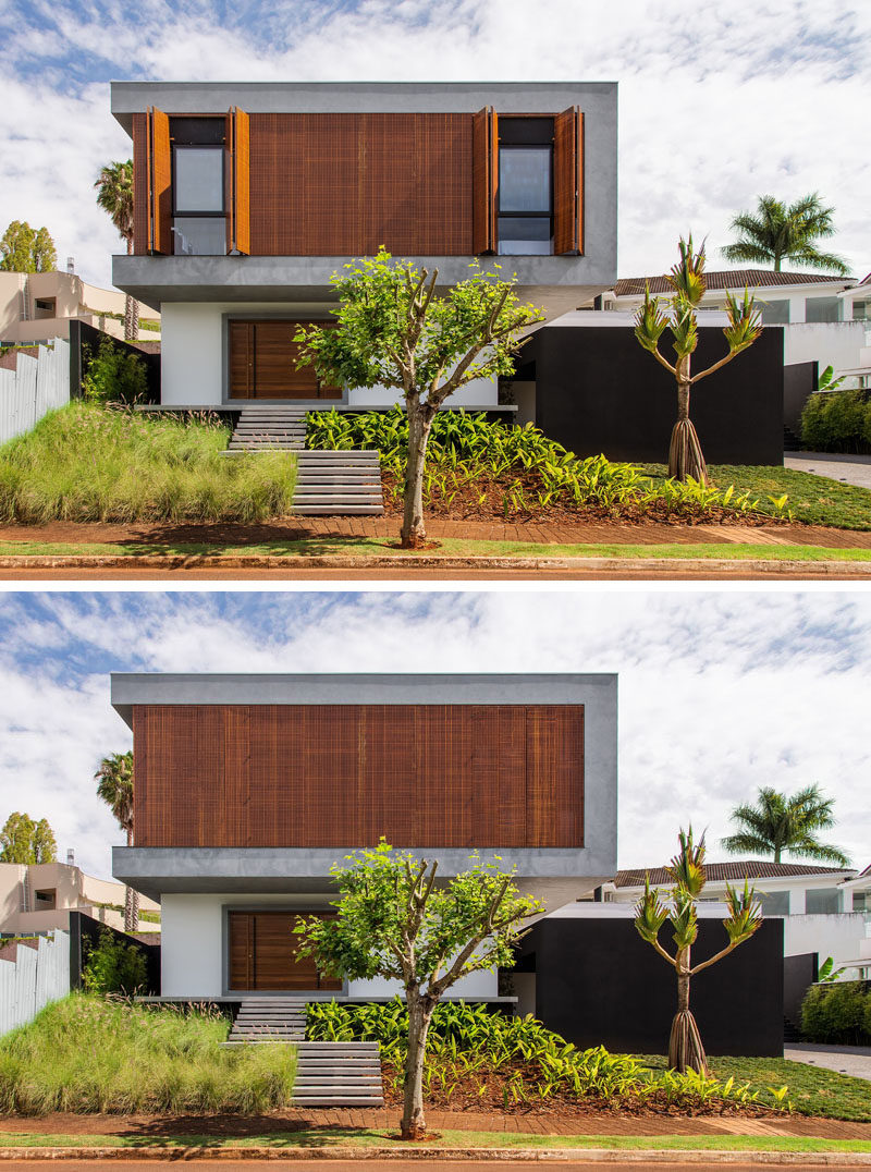 Carolina Sakuno and Fausto Cintra of CF Arquitetura have designed this contemporary home for a young family in Londrina, Brazil. From the street, the two-storey house has large wooden shutters on the upper floor that provide privacy and security, while landscaping guides you to the wooden front door.