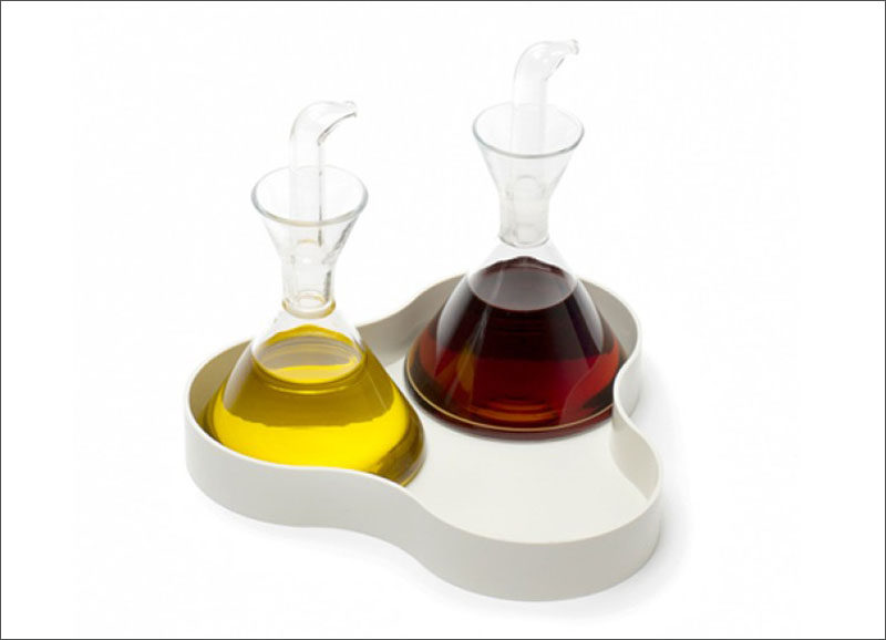 Essential Kitchen Tools - 11 Creative Oil & Vinegar Dispensers // These oil and vinegar dispensers sit in a little tray making it easier to place on your table and not have to worry about potential drip stains on your table cloth.