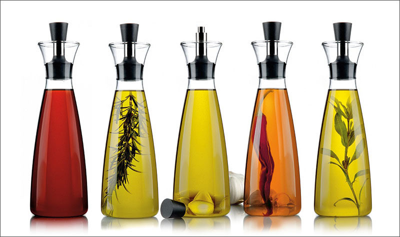 Essential Kitchen Tools - 11 Creative Oil & Vinegar Dispensers // Tall oil dispensers like these are perfect for adding herbs and other things to infuse your oil at home and makes the display much nicer to look at.