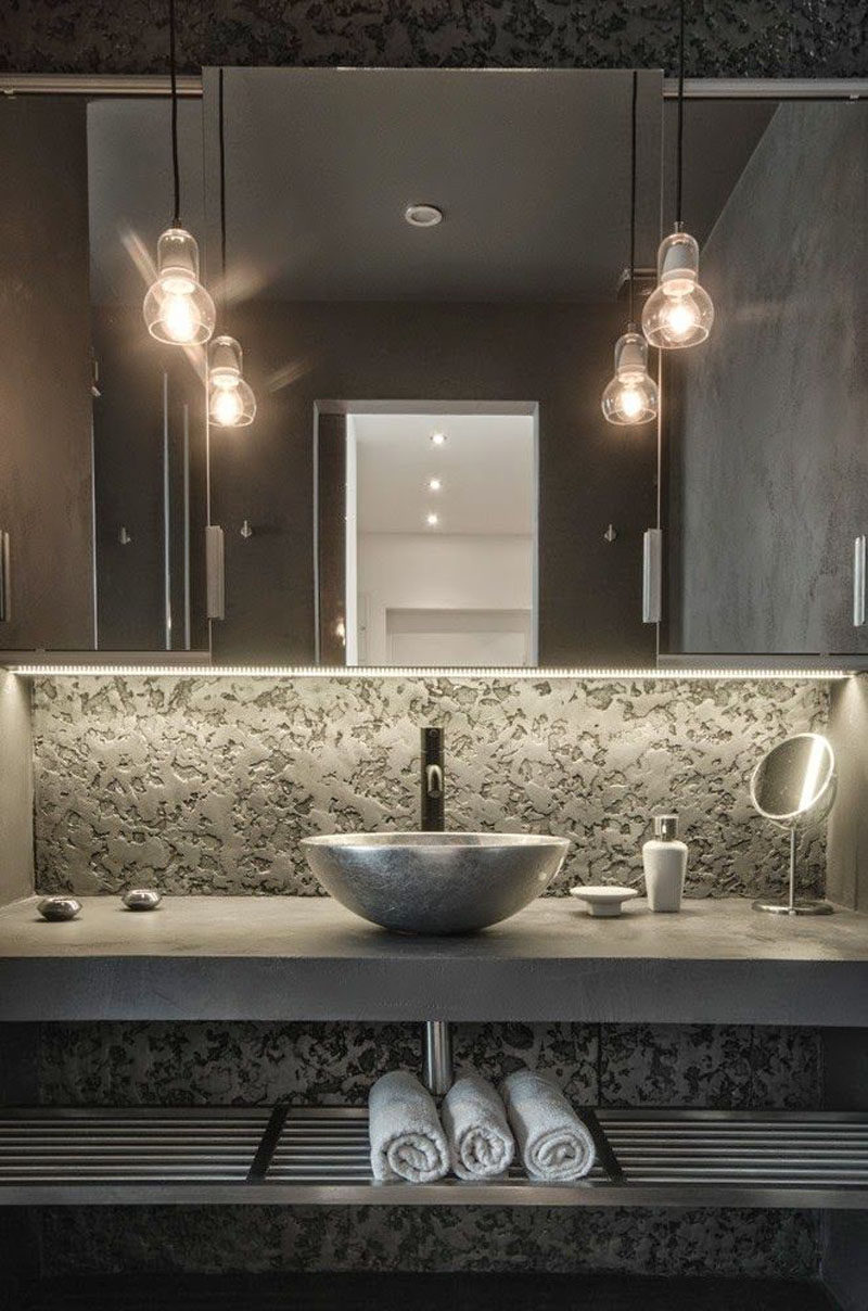 Bathroom Design Ideas - Open Shelf Below The Countertop // The dark colors used in this bathroom and the metal shelf under the sink give this bathroom an industrial look.