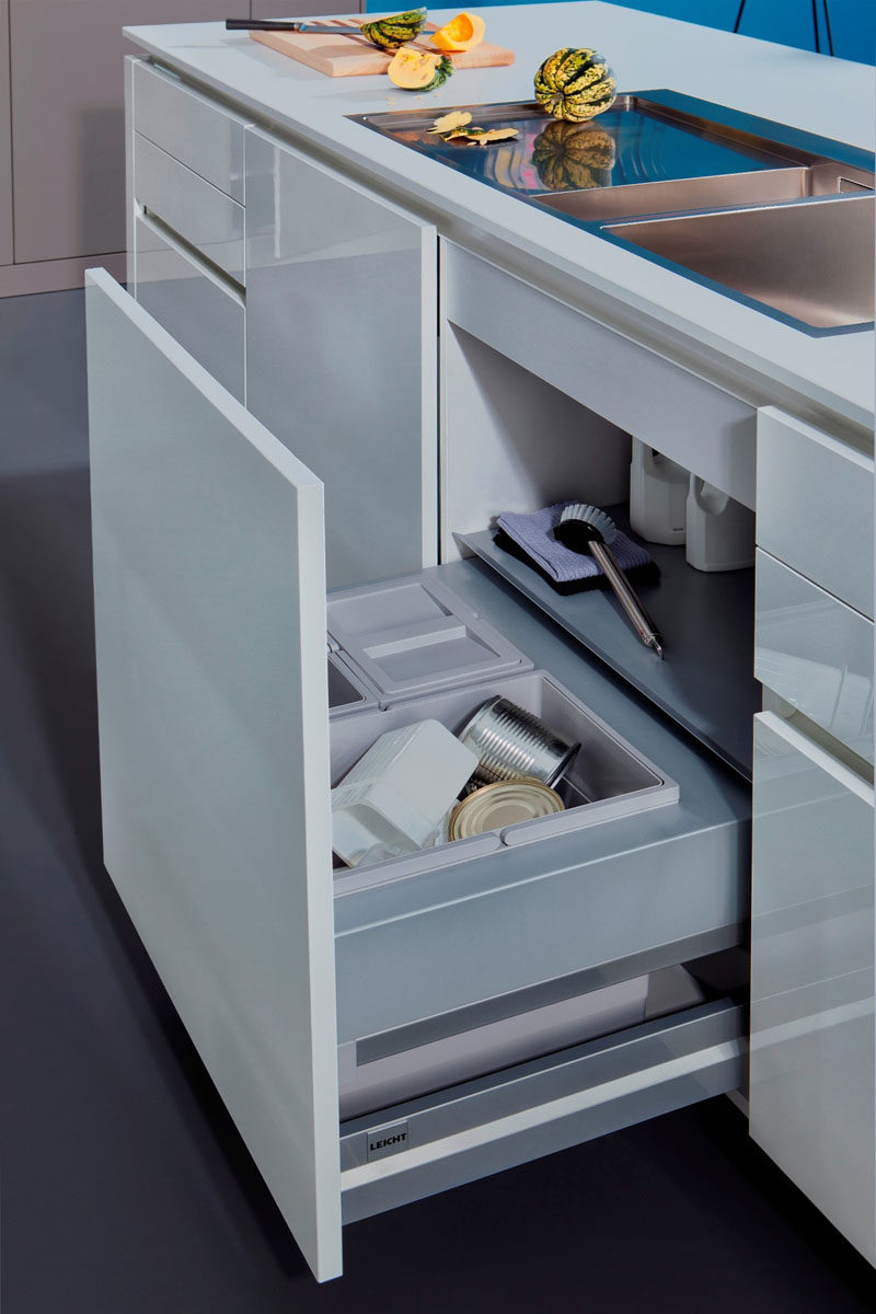 Kitchen Design Idea - Hide Pull Out Trash Bins In Your Cabinetry // The handles on the bins make it easy to pull them out when they're full and carry them out to the curb.
