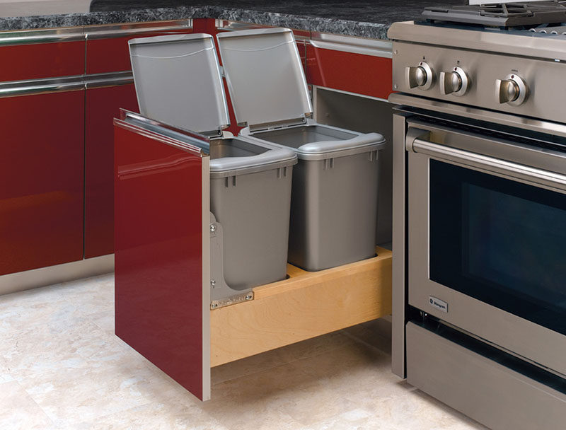 Kitchen Design Idea - Hide Pull Out Trash Bins In Your Cabinetry // The lids on these pull out help keep odors contained and can easily be removed when it's time to take out the bag or dump out the compost.