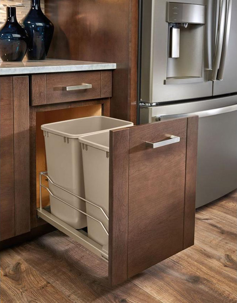 Kitchen Design Idea - Hide Pull Out Trash Bins In Your Cabinetry // If lids aren't for you leave them off and make accessing the trash that much easier.