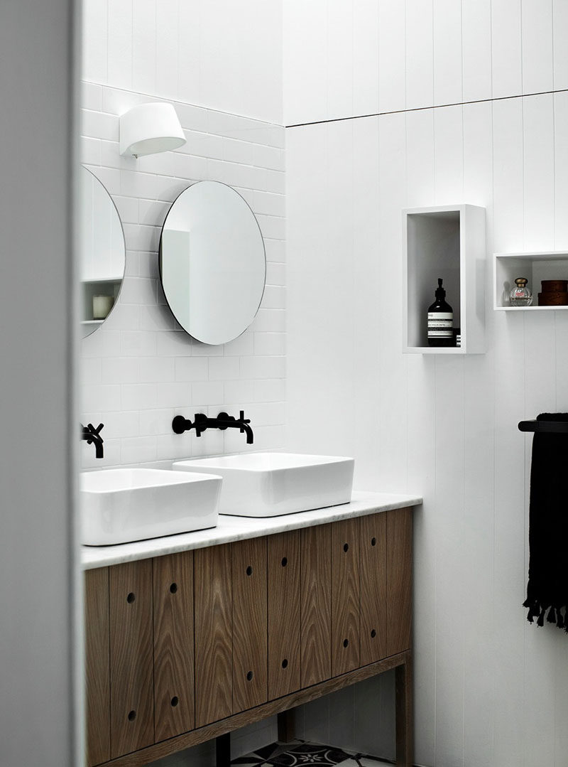 5 Bathroom Mirror Ideas For A Double Vanity // Two circular mirrors are a simple way to make your bathroom slightly more unique and can break up a bathroom dominated by hard, solid lines.