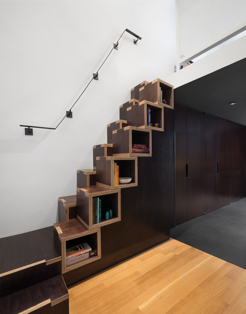 13 Stair Design Ideas For Small Spaces // These staggered wooden stairs also double as convenient shelving thanks to their cubby-like form.