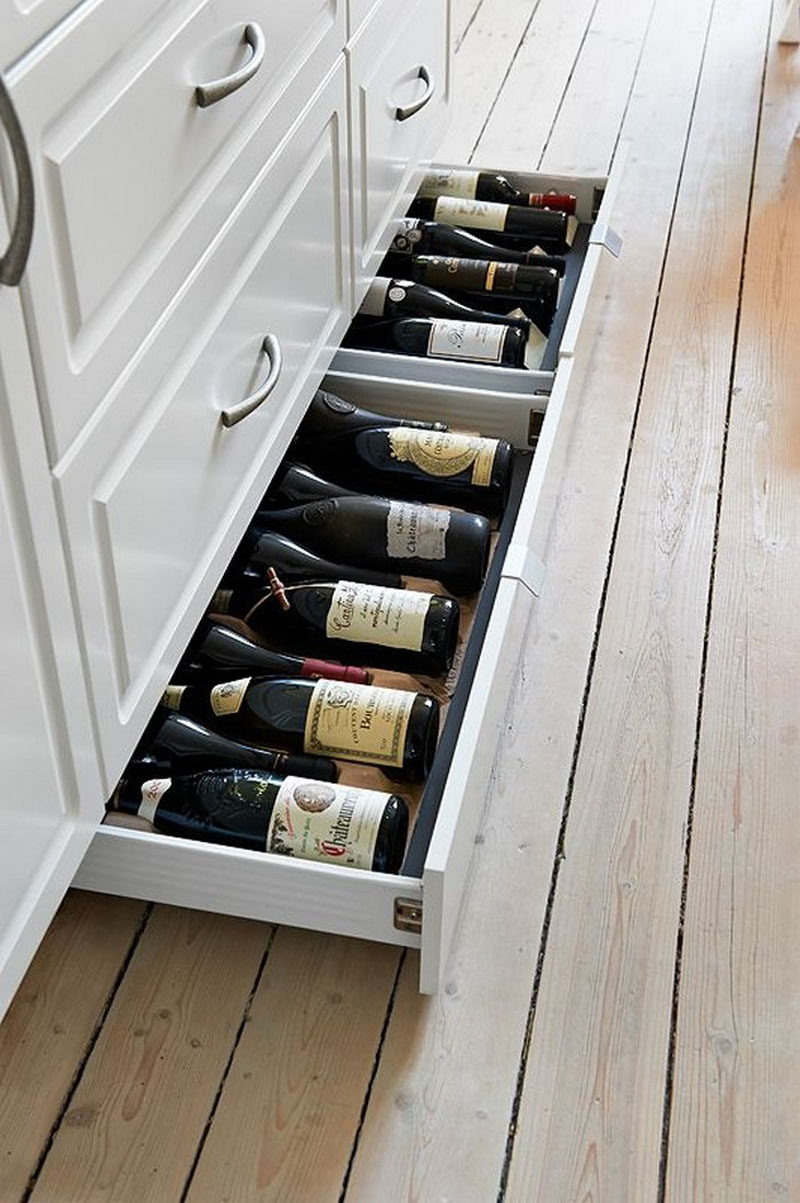 Kitchen Design Idea - Toe Kick Drawers // They are perfect for wine storage.