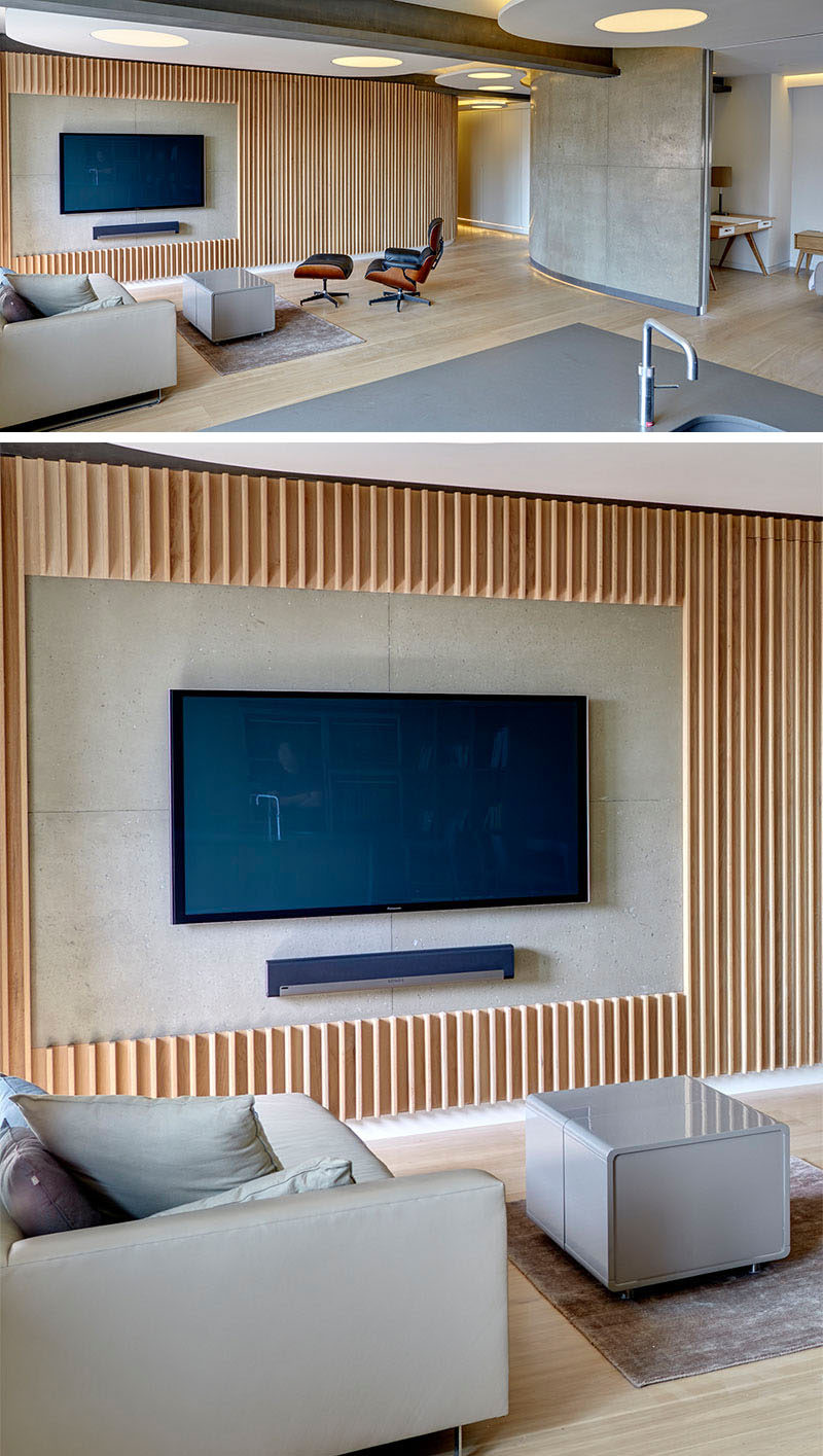 8 TV Wall Design Ideas For Your Living Room // Thin wood panels have been cut to frame the TV and sound bar to make it the main feature in the room.