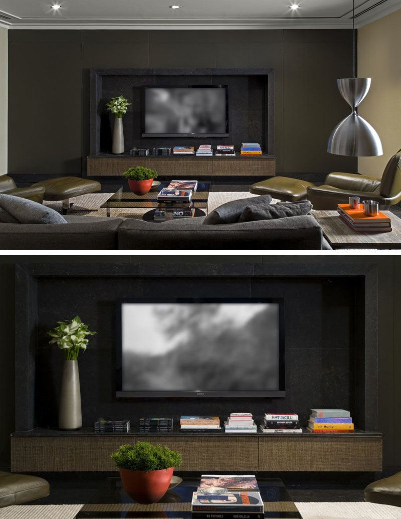 8 TV Wall Design Ideas For Your Living Room // This entertainment system has been set deep into the wall and surrounded with a frame and a shelf to make it the main focus in the room.