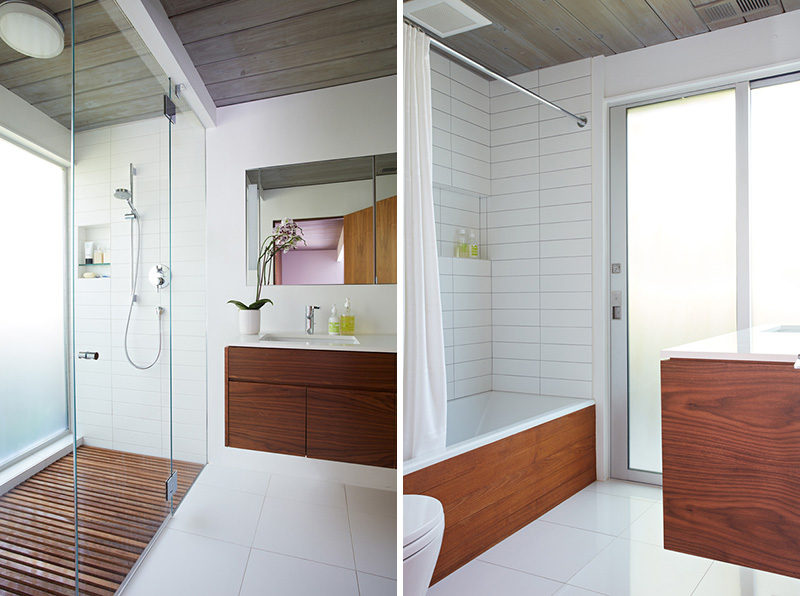 In the bathrooms of this remodeled mid century modern house, wood has been combined with white tiles on the walls and floor to create a clean contemporary look.