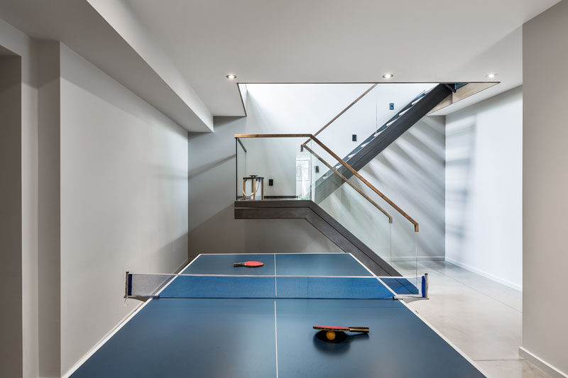 The basement of this contemporary home has been set up as a games room and play space for children.