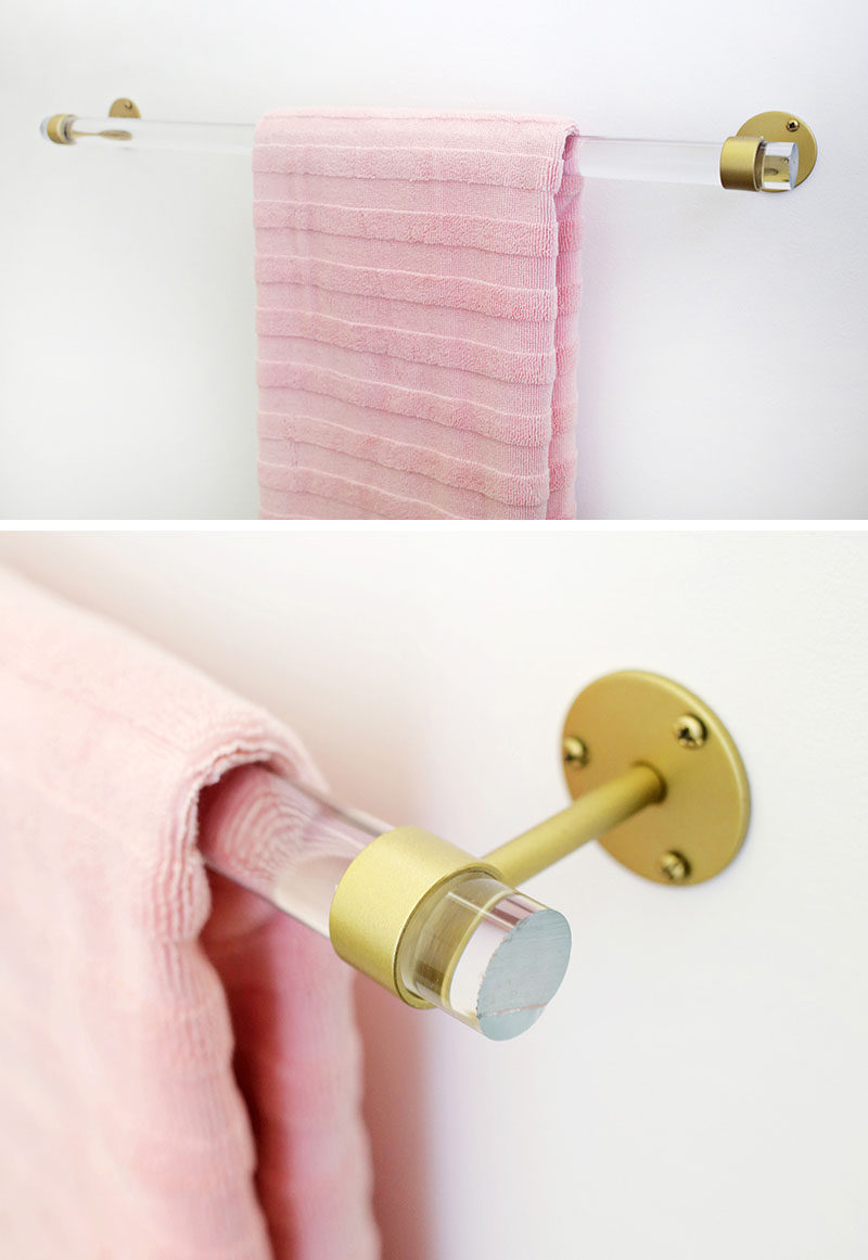5 Ways To Use Acrylic Decor Throughout Your House // Bathroom - The gold hardware and pink towel sitting on this a towel rack create a simple, girly look in the bathroom.