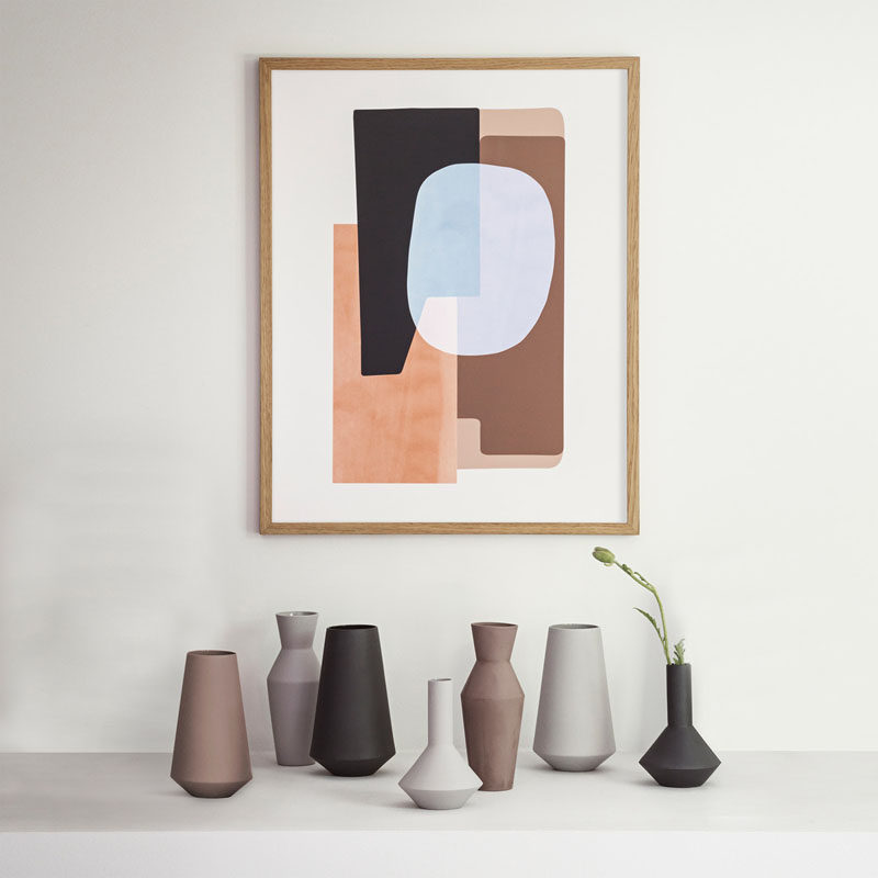 Home Decor Ideas - 6 Ways To Include Ceramic In Your Interior // Matte ceramic vases in different shapes and colors creates a dynamic display that's made even more fun with the addition of plants in just a few of them.