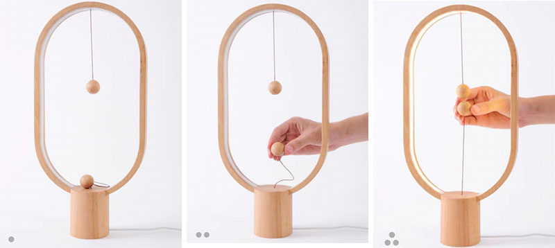The Heng Balance Lamp, designed by Li Zanwen, is a table lamp made from high quality wood and two magnetic balls attached to an internal switch that's designed to make brightening all of your spaces a little more fun and a little less mundane.