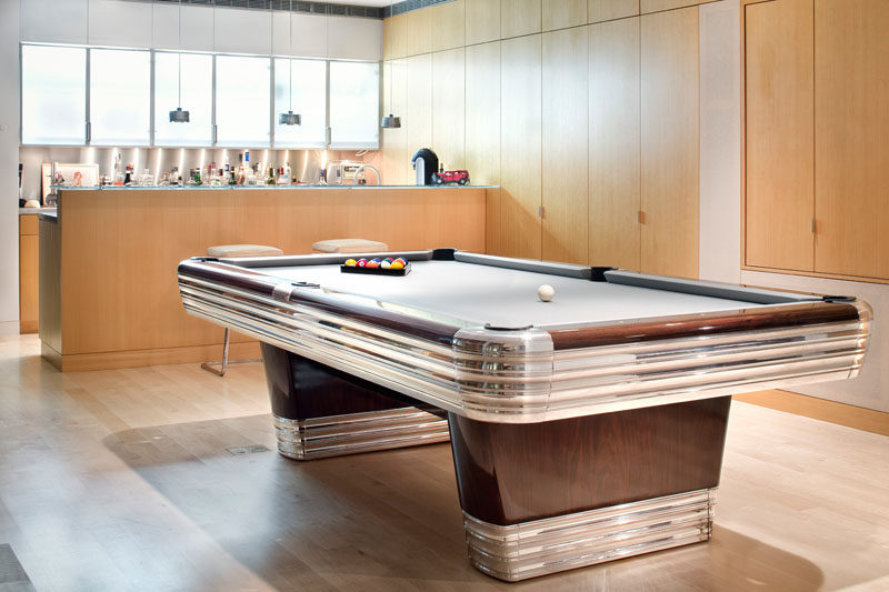 This contemporary home has a games area with pool table and bar.