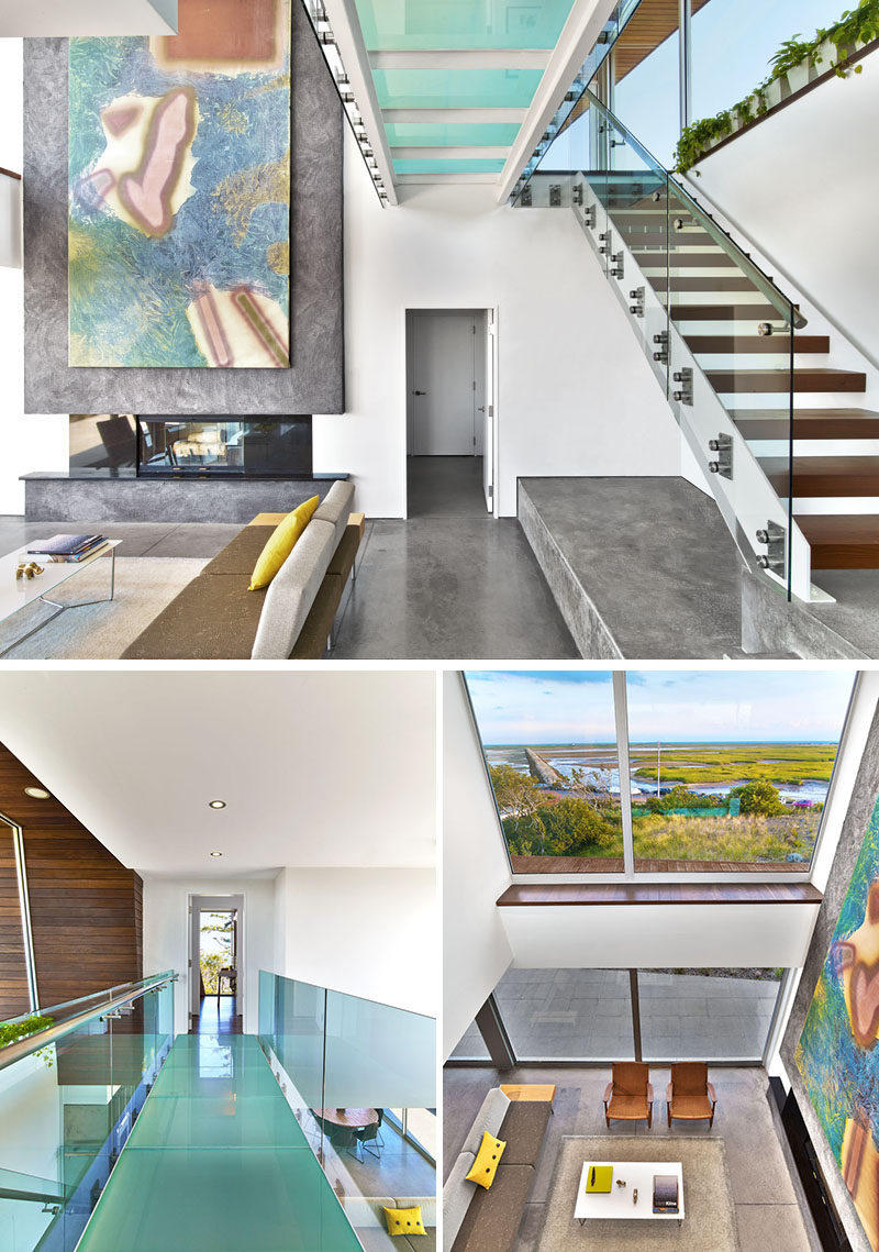 In this modern house, a glass-bridge connects the bedrooms upstairs, and provides an alternative view of the living room below and the marsh beyond.