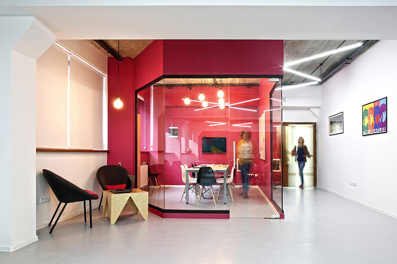 Interior Design Idea - Use Color To Define An Area // For this meeting room, the interior designers used hot pink on the exterior and interior of the room, creating a bright and bold look for the space that you can't miss.