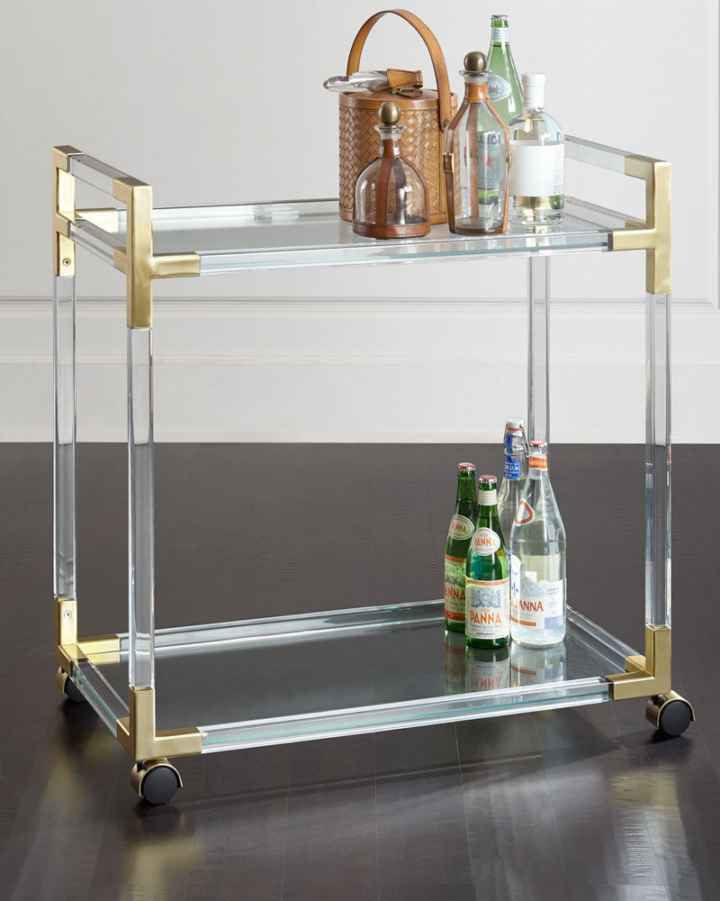 5 Ways To Use Acrylic Decor Throughout Your House // Living Room - An acrylic and brass bar cart lets guests know you're all about having a good time in style.