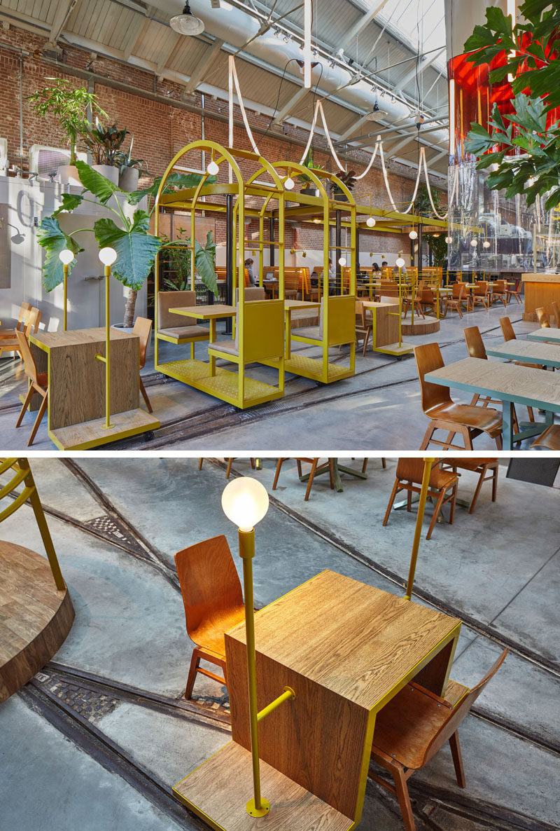 These table and chairs on a stand, have small wheels that are positioned within tram rails, giving this restaurant and bar a playful touch.