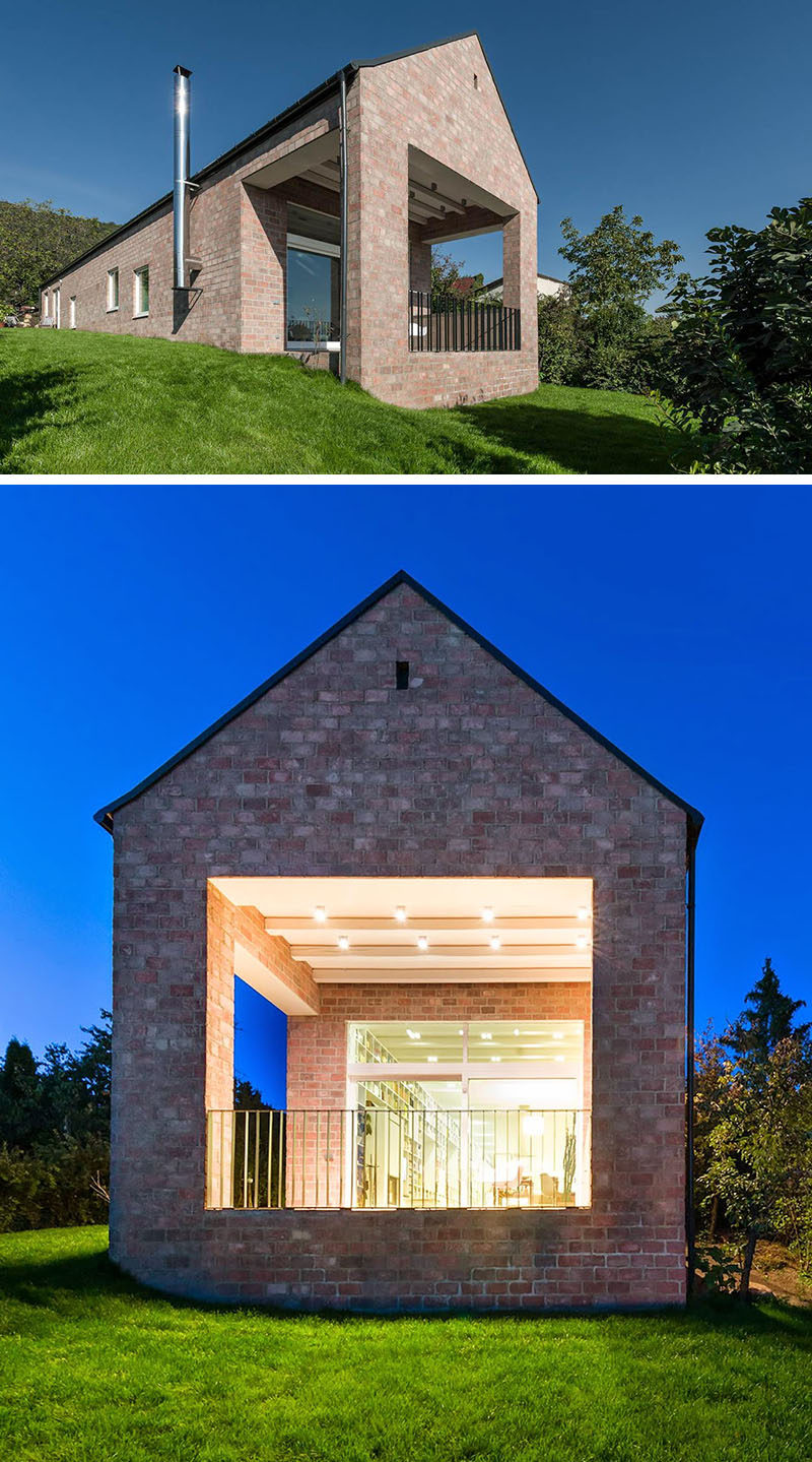 14 Modern Houses Made Of Brick // The brick covering this house give it a traditional look while the gabled roof keeps the design looking minimal and modern.
