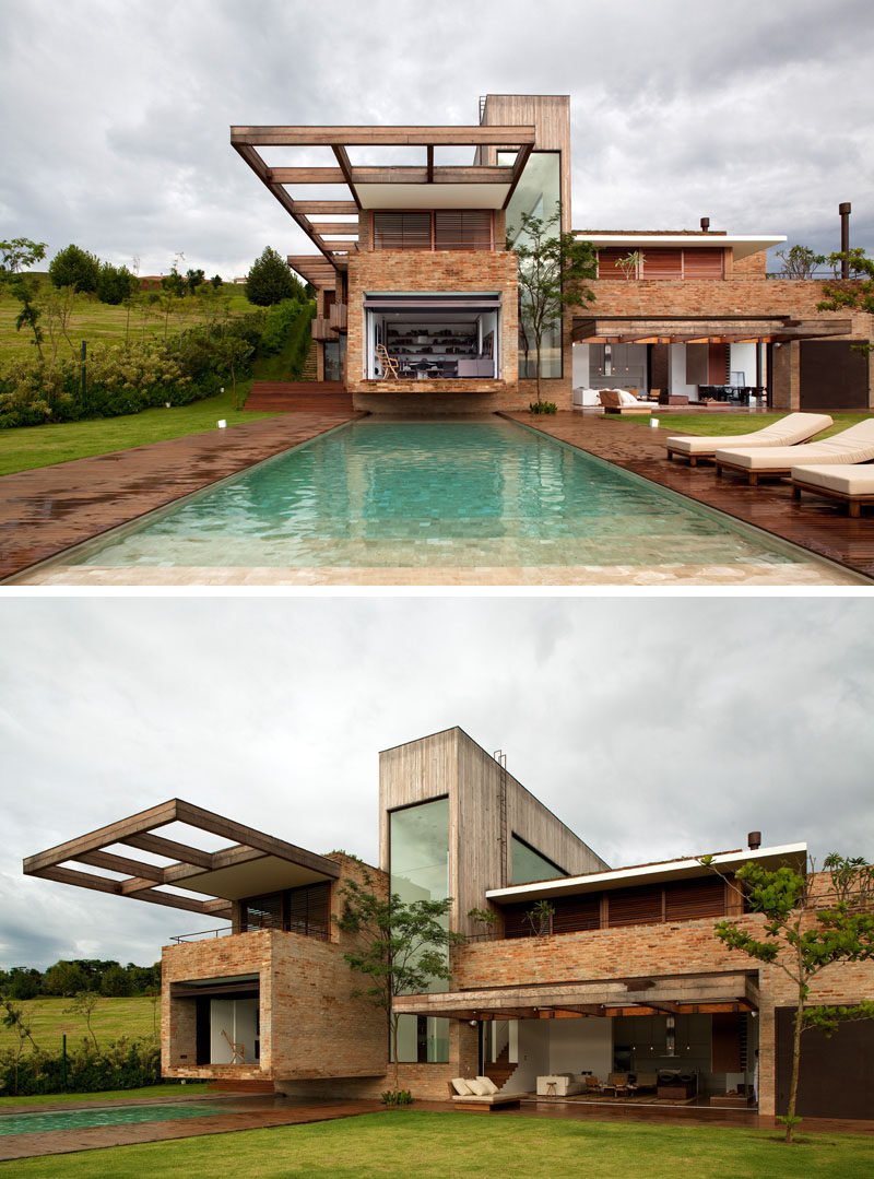 14 Modern Houses Made Of Brick // The bricks used to cover this modern home came from various torn down houses to give the bricks new life and create a more textured exterior on the house.