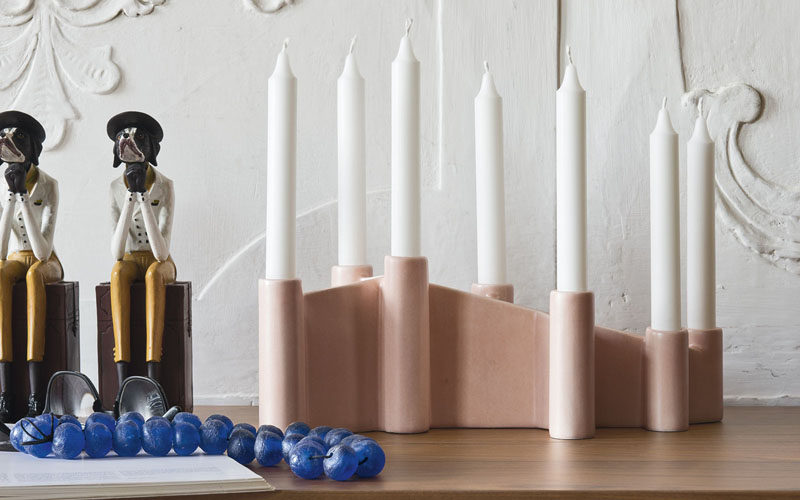 Home Decor Ideas - 6 Ways To Include Ceramic In Your Interior // Brighten up your home with 7 candles that sit in a single ceramic holder.