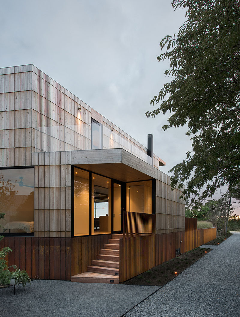 On the exterior of this home, a system of bronze bars was developed to allow the the thick cedar siding board to be attached without fastening through the wood.