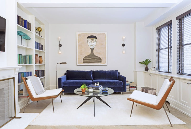 4 Ways To Use Navy Home Decor To Create A Modern Blue Living Room // If you want to add navy decor to your living room but aren't quite ready to cover your walls in the color, try adding a navy couch. 