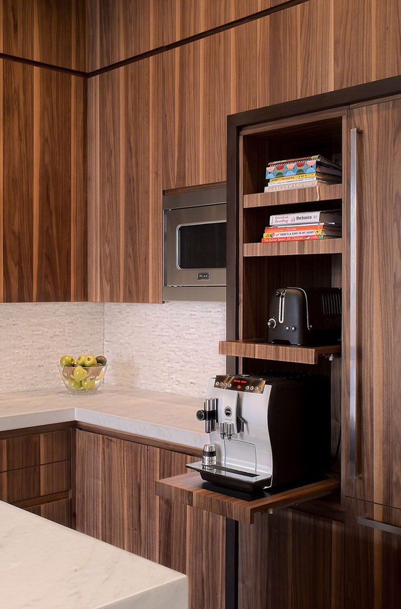 Kitchen Design Idea - Pull-Out Counters (10 Pictures) // Pull-out counters don't just have to go underneath the counter. Put them up higher to make sliding shelves that free up your countertops and keep your appliances easily accessible.