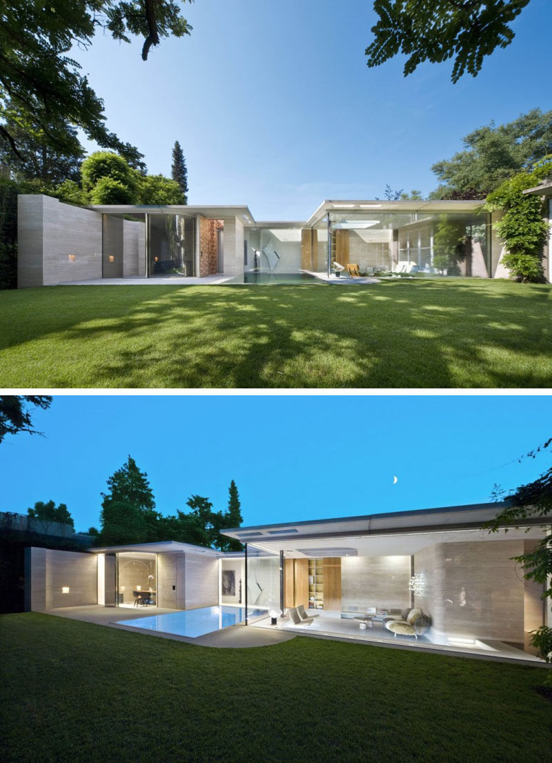 15 Single Story Modern Houses | Glass walls make up the back of this single story house to let in all the natural light and keep the home feeling bright and airy.