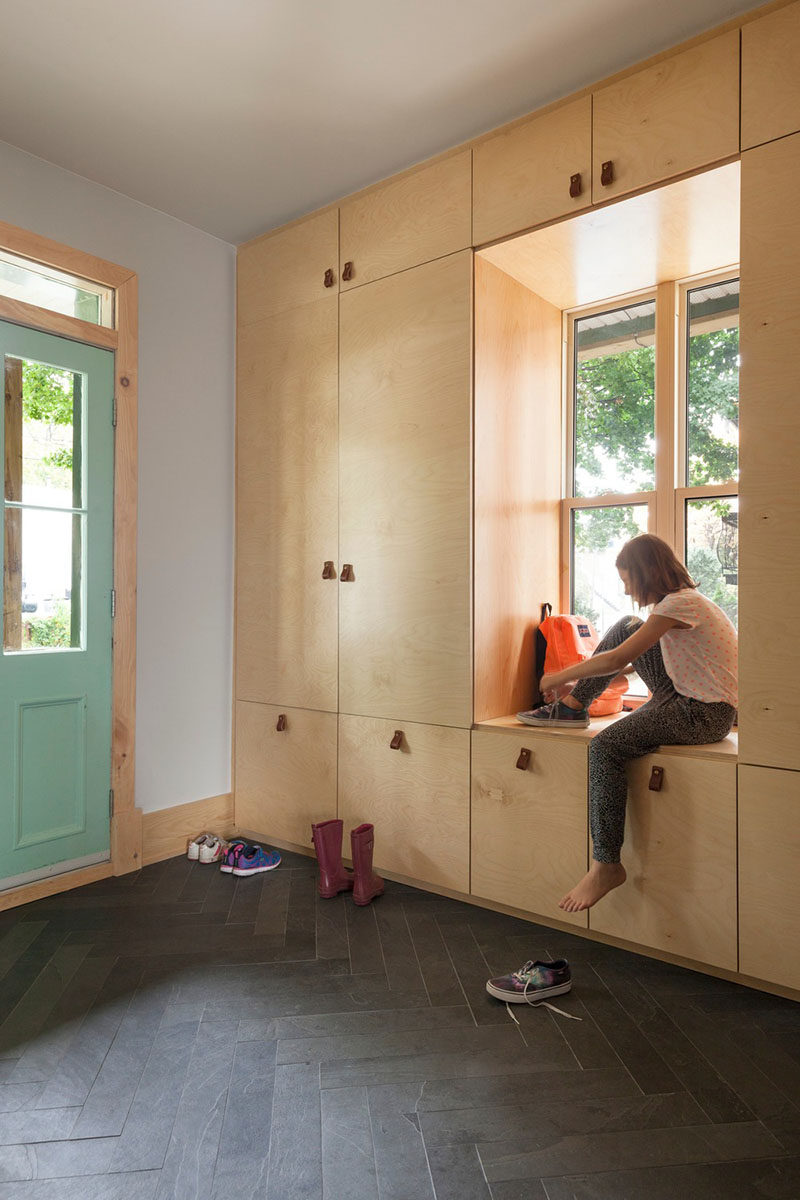 Entryway Design Ideas - A Window Bench Seat Surrounded By A Wall Of Storage