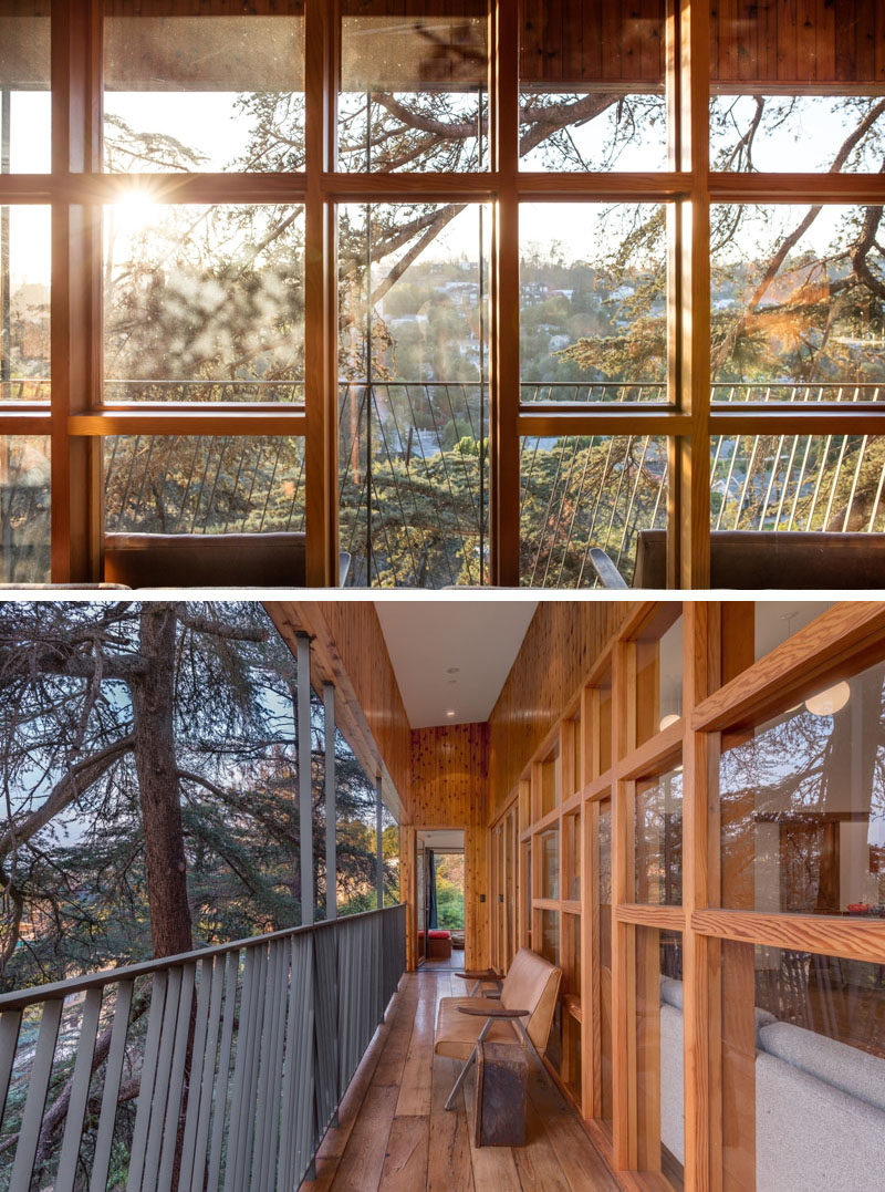 Wood framed windows provide plenty of sunlight and views to the living space. Outside there's a narrow balcony for enjoying the view.