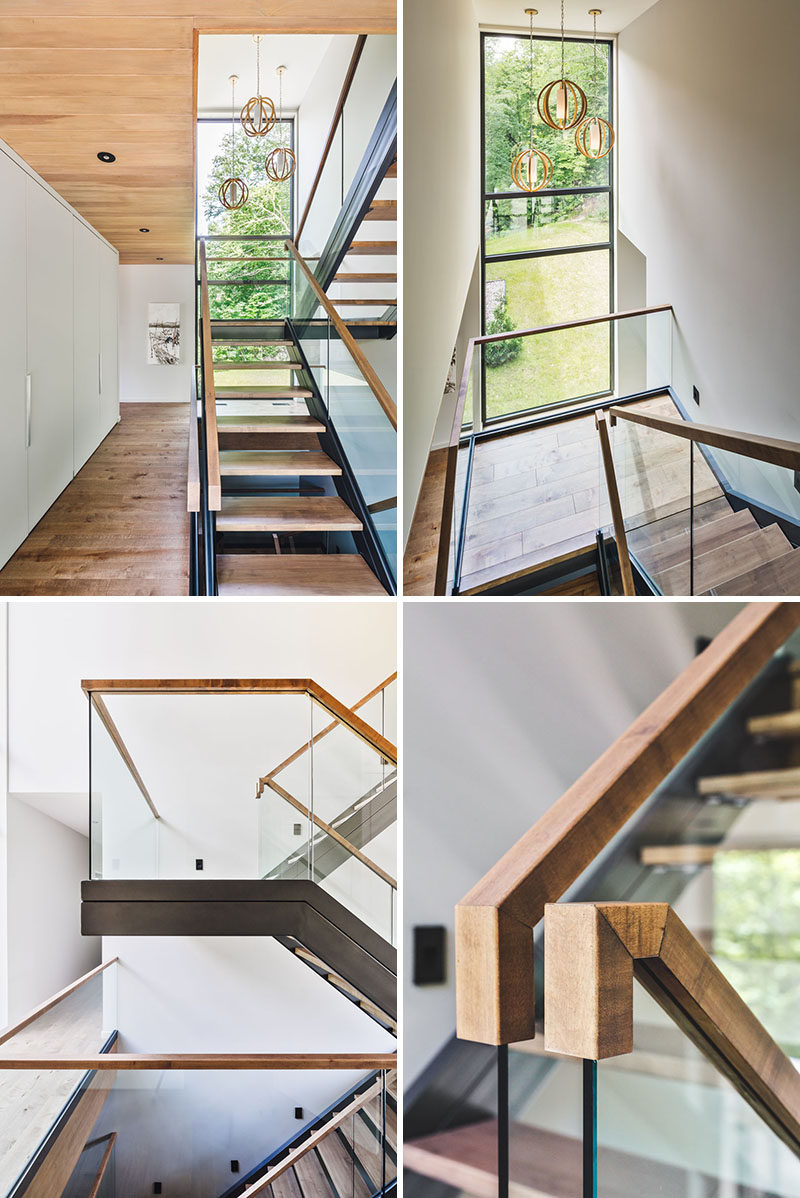 A wall of white cabinetry sits beside these stairs for extra storage, and the stairs themselves have been made from wood and steel, while the glass lets the light shine through.