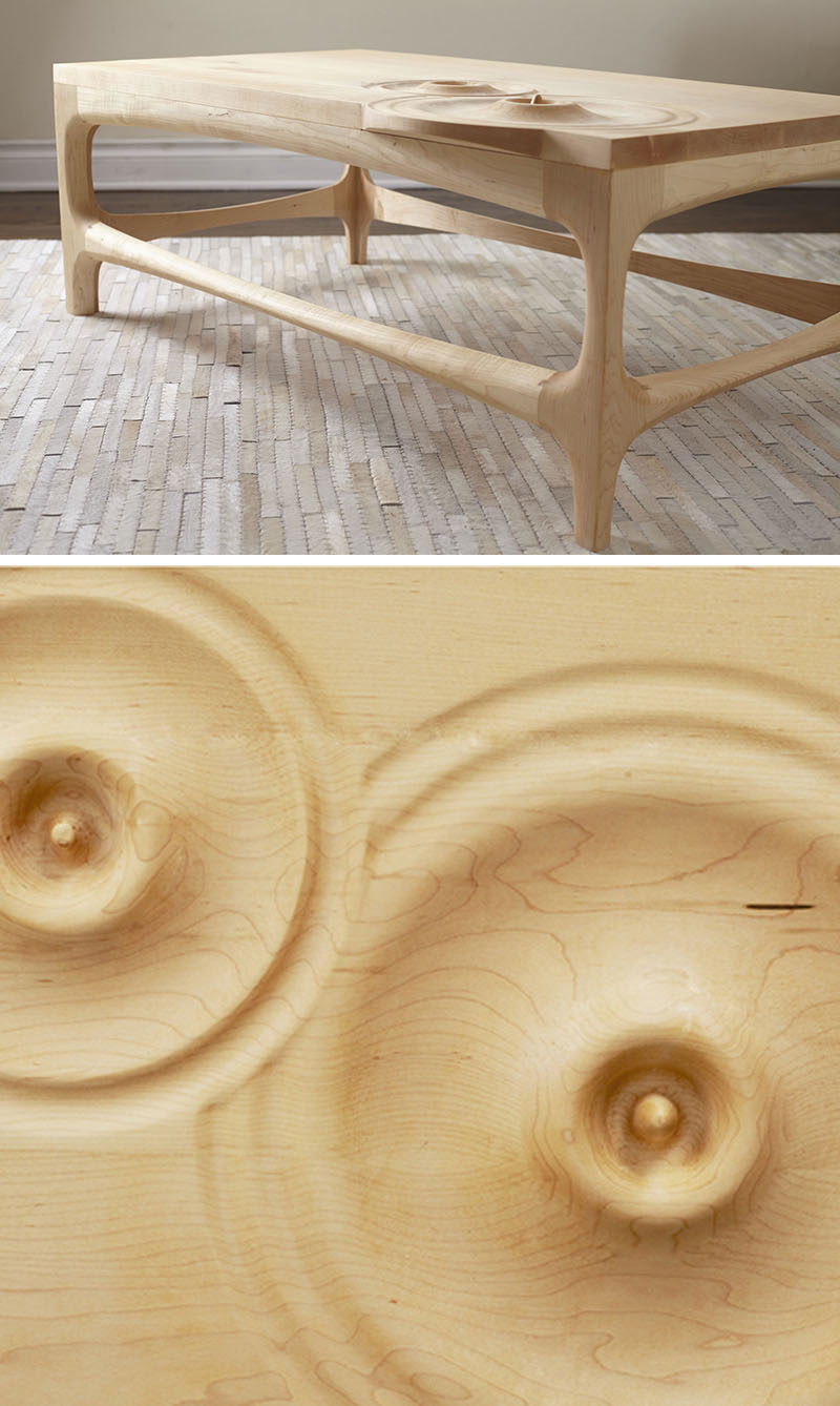 This wooden coffee table features carved sections that look like water droplets.