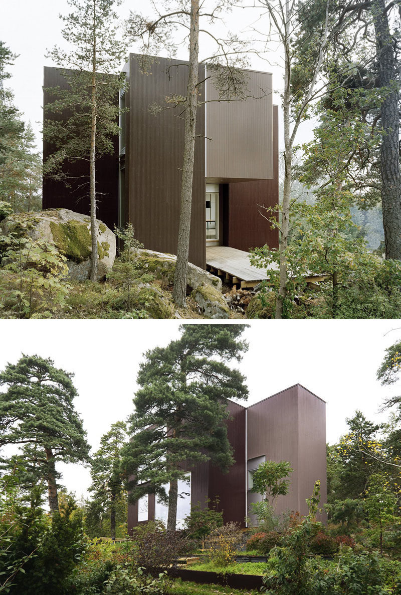 19 Examples Of Modern Scandinavian House Designs | The dark wood siding covering this secluded home helps it blend into the forest surrounding it and gives it a more natural feel.