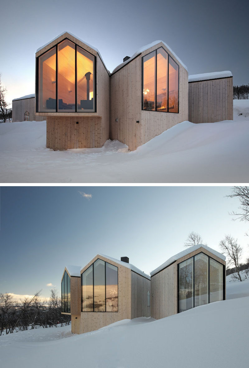 19 Examples Of Modern Scandinavian House Designs | Multiple wood clad structures feature black framed windows that look out at different angles to create a unique design, a dramatic contrast, and offer a variety of views.