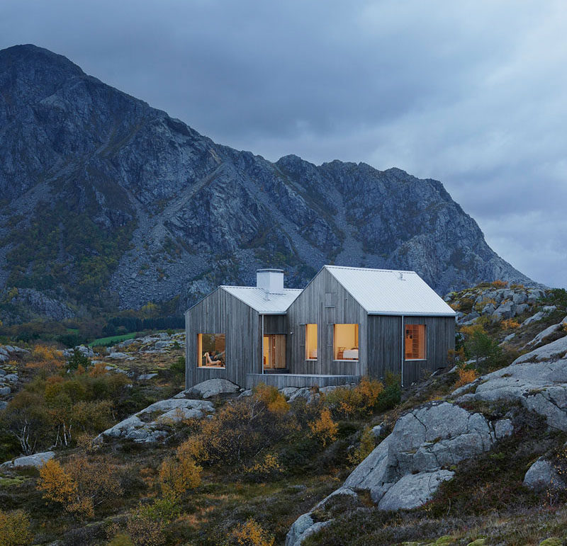 19 Examples Of Modern Scandinavian House Designs | The wood siding on this secluded island home blends right into the rocks and vegetation to keep the house private and unobtrusive.